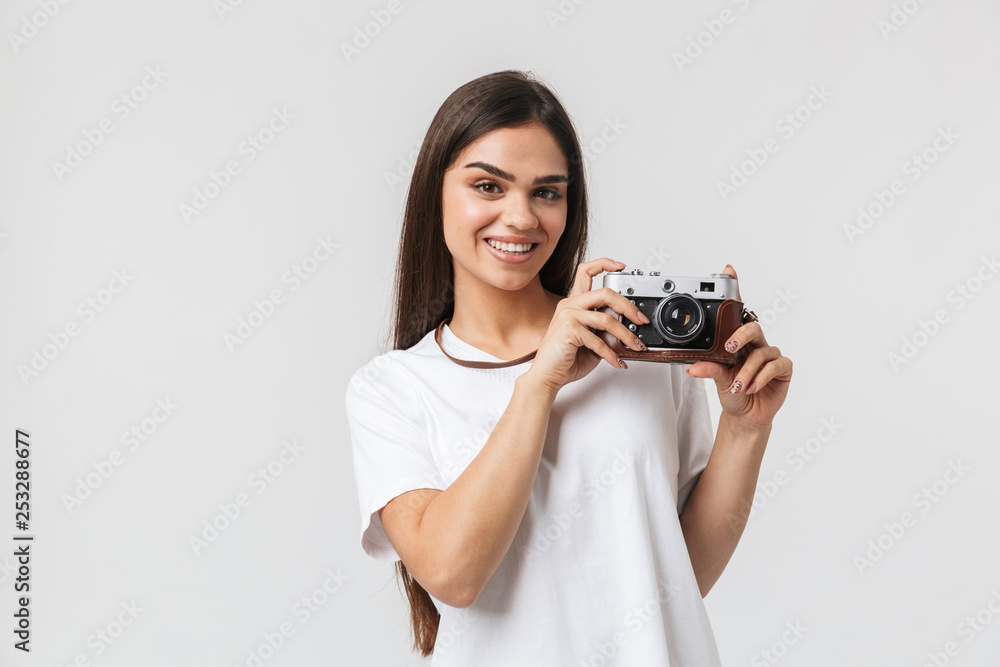 Happy young girl standing isolated over