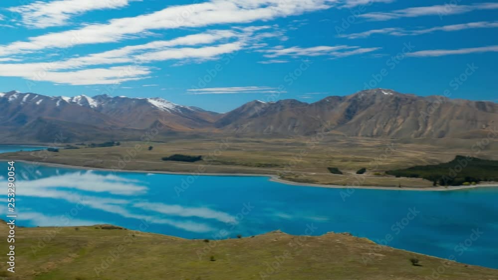 Lake Tekapo with reflection of sky and mountains, New Zealand Lake Tekapo with reflection of sky and mountains, New Zealand