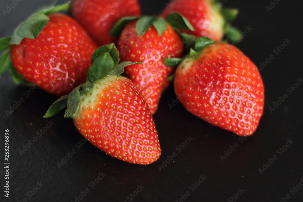 fresh red tasty sweet strawberry, on black background fresh red tasty sweet strawberry, on black background
