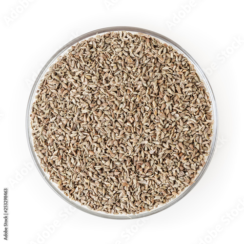 Anise seeds in glass bowl isolated on white background with clipping path