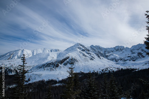 Landscape view of mountain tops in the Zakopane and in Poland area covered with fresh snow during a sunny day © Lukas