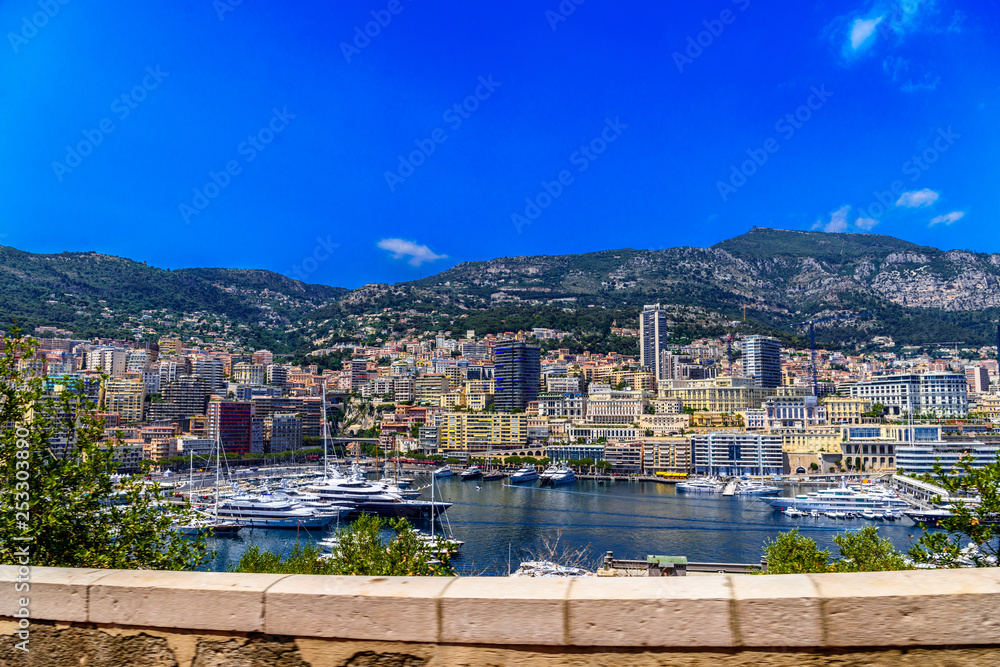 Yachts in bay near houses and hotels, La Condamine, Monte-Carlo, Monaco, Cote d'Azur, French Riviera