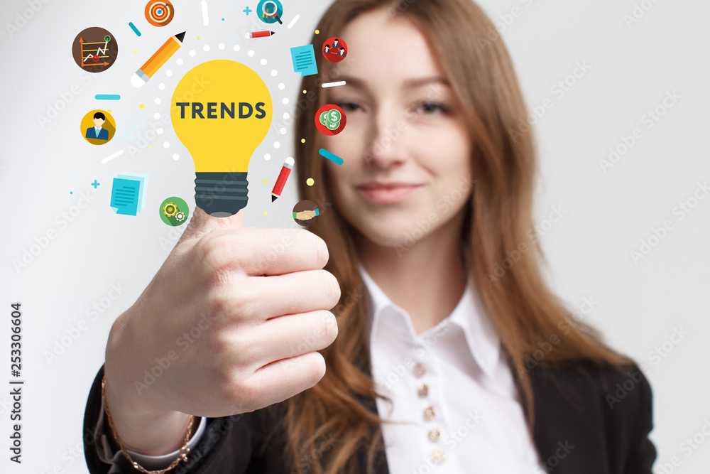Business, technology, internet and networking concept. Young entrepreneur showing keyword: Trends