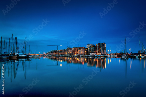 Aarhus    seen at night time with water reflections and Aarhus Marina in the foreground