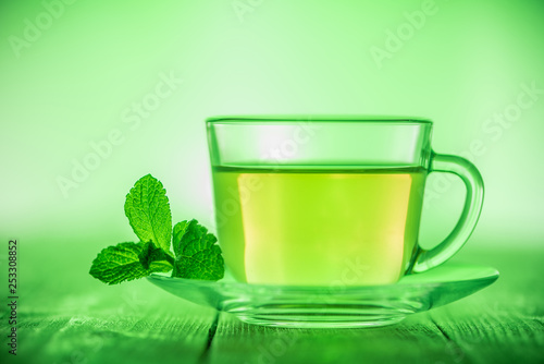 A cup of green tea with mint