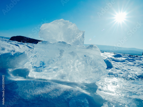 Blocks of ice gleaming in the sun. Arctic winter background. © flying creature