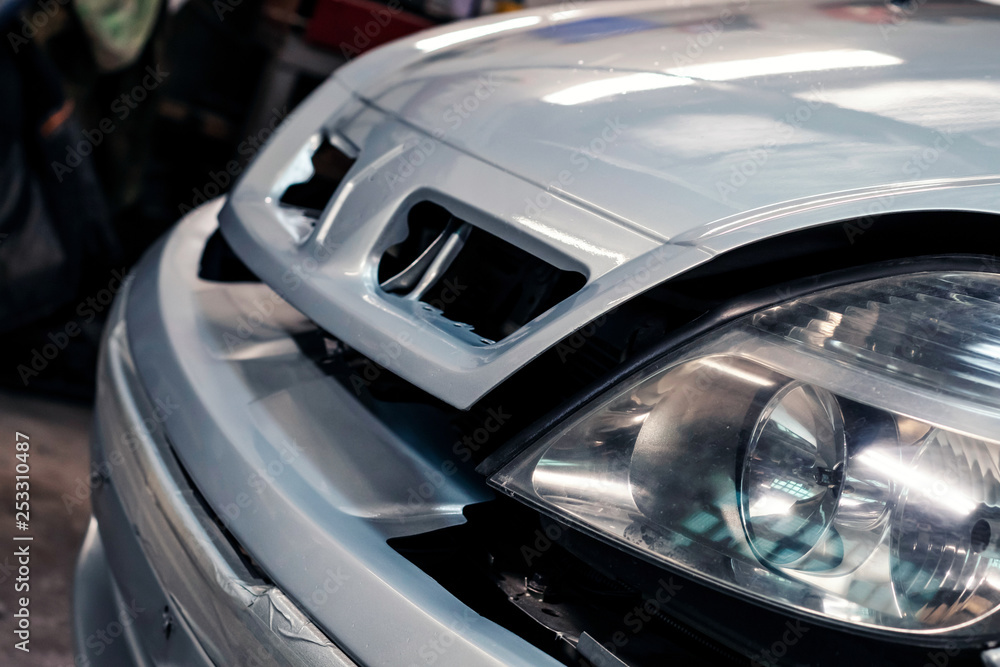 Car painted in garage. Close-up, color silver metallic. Car painted in garage. Close-up, color silver metallic.