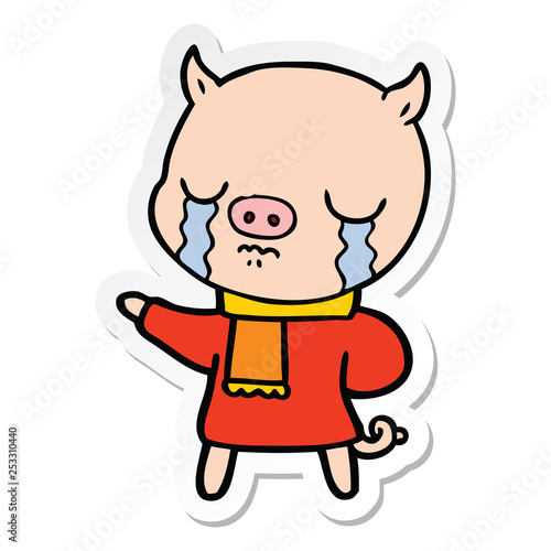 sticker of a cartoon crying pig wearing scarf