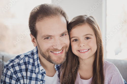 Close-up portrait of his he her she nice charming attractive cheerful cheery pre-teen girl dad daddy in light white interior room indoors