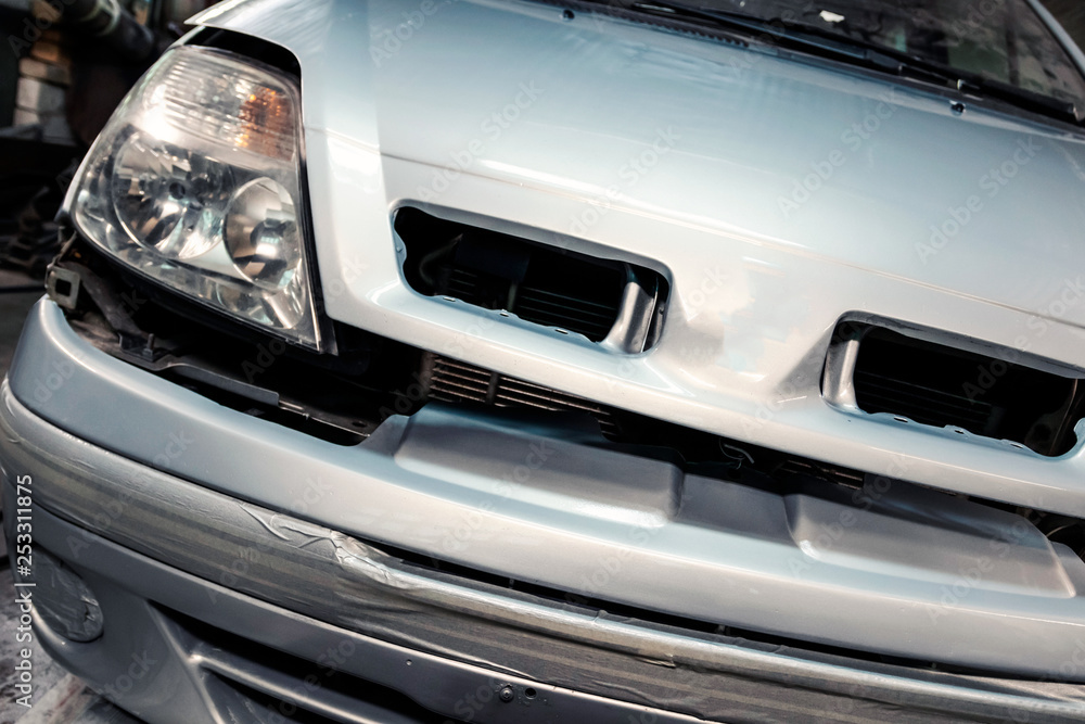 Car painted in garage. Close-up, color silver metallic. Car painted in garage. Close-up, color silver metallic.