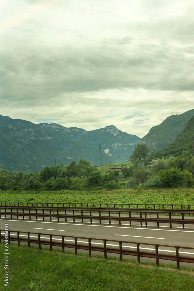 Naklejka premium Italy,La Spezia to Kasltelruth train, a wineyard with a mountain in the background