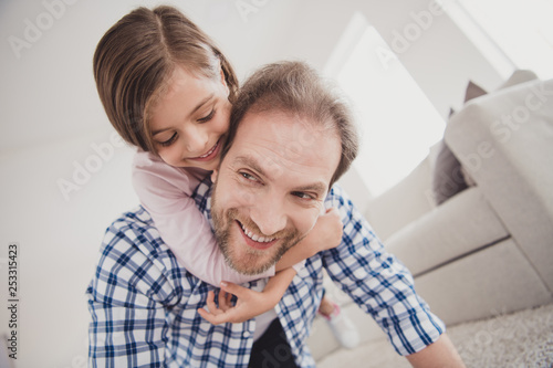 Close-up portrait of his he her she nice cute sweet lovely attractive pre-teen cheerful cheery dreamy positive girl handsome bearded dad daddy having fun holding in light white interior room © deagreez