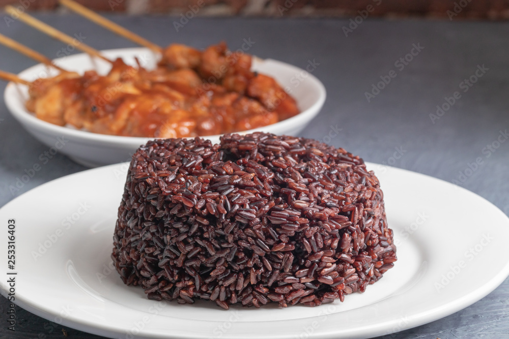 close up of steamed riceberry rice on plate close up of steamed riceberry rice on plate