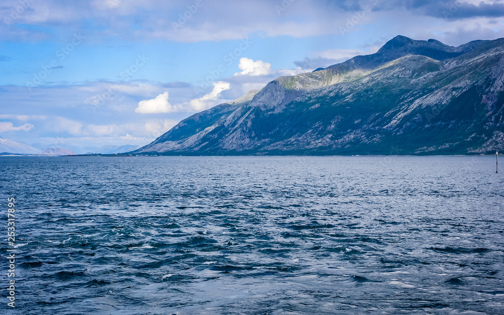 Stone fjord coast in Norway at sunset