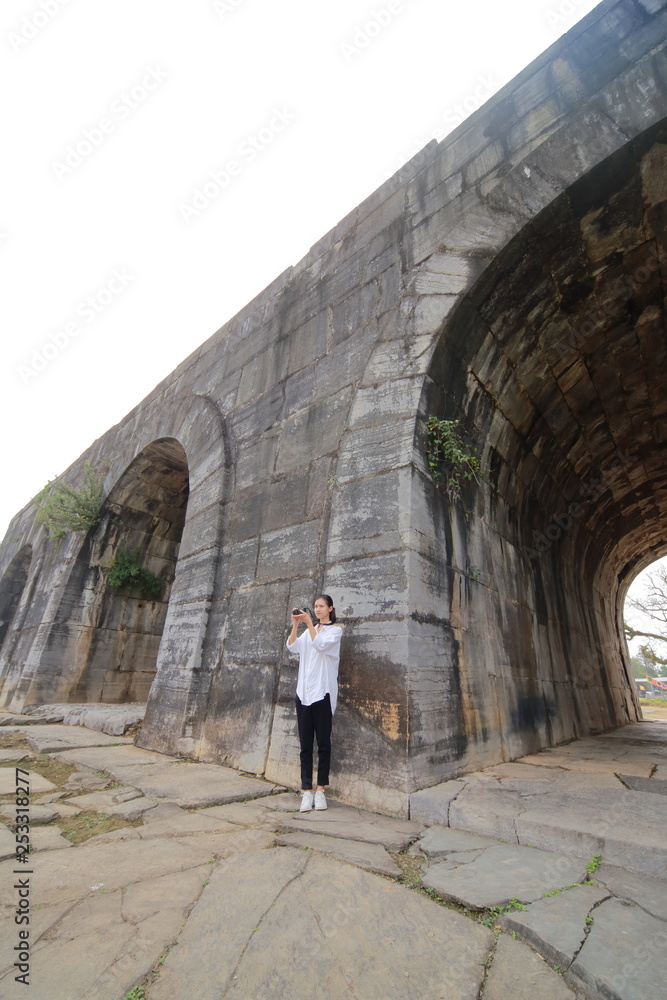 woman traveling to Ho citadel in Thanh Hoa,Vietnam