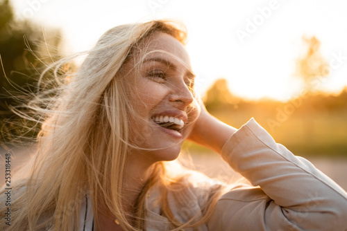 Pretty fashion model posing with big smile