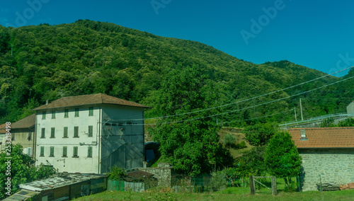 Italy,La Spezia to Kasltelruth train, a house with bushes in front of a building