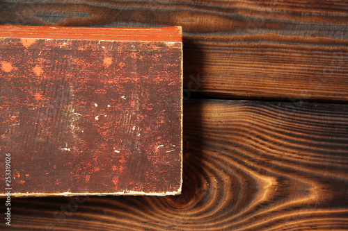 Old book on wooden background