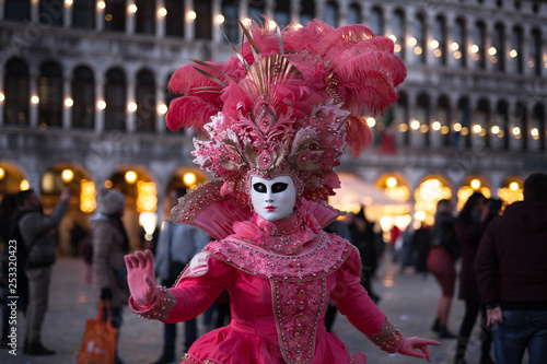 Venice Carnival 2019. San Marco Square. Venetian masked model on the laguna streets © Andrey Cherkasov