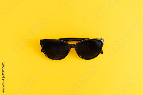 sunglasses on yellow background