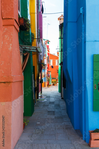 Venice, landmark of Burano island, canal and colorful buildings