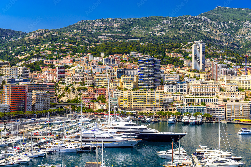 Yachts in bay near houses and hotels, La Condamine, Monte-Carlo, Monaco, Cote d'Azur, French Riviera