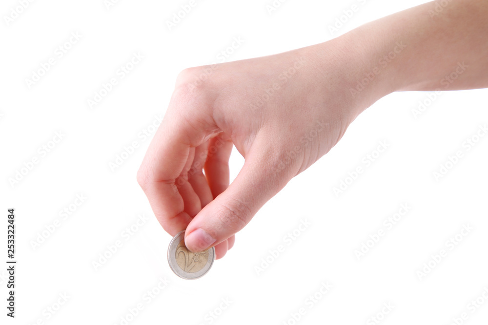 A female hand hold a coin isolated white at the studio.