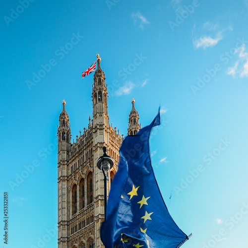 Brexit concept with European union flag juxtapositioned against Victoria tower, Westminster, London, UK photo