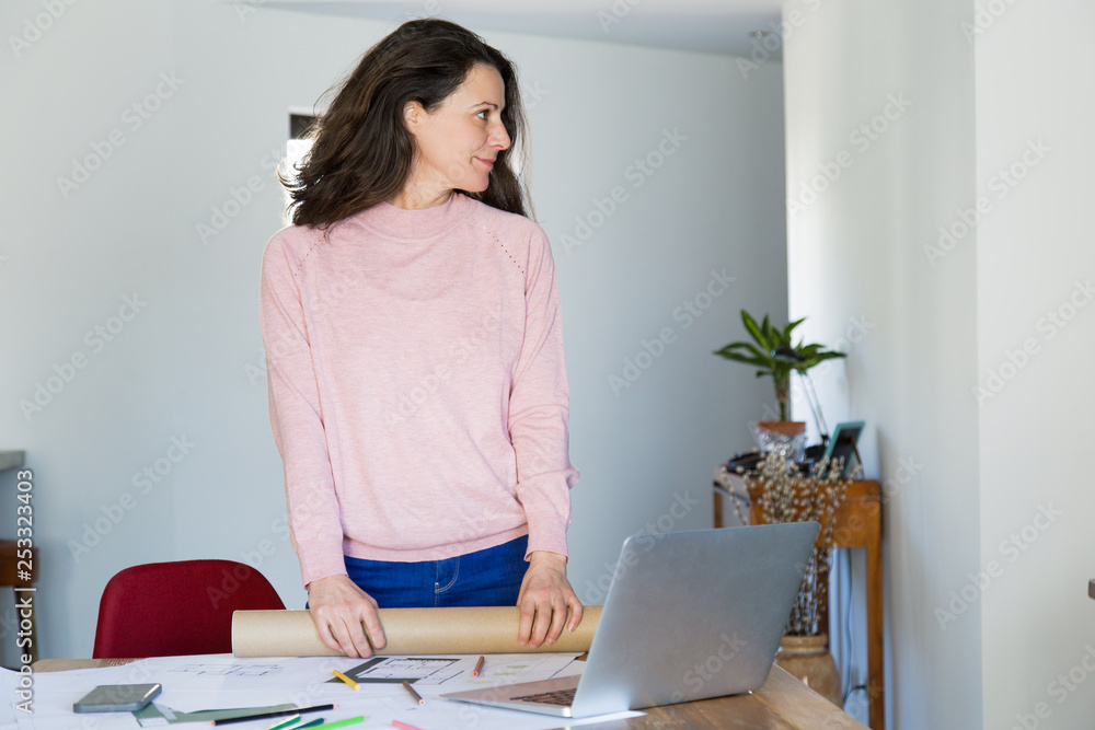 Positive young architectural designer at work Positive young architectural designer at work