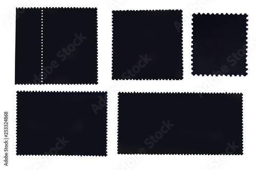 Set of isolated black postage stamps reverse side with the edge of the sheet