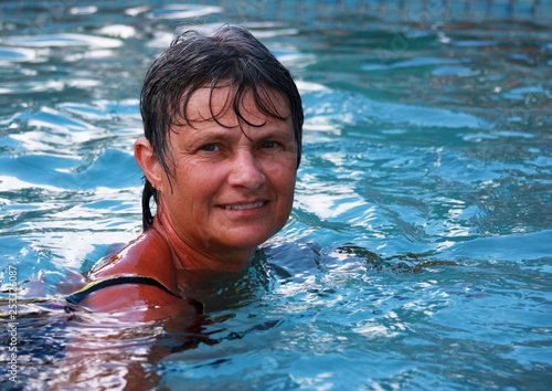 Woman relaxing in an outdoor pool