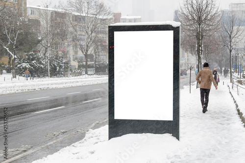 Billboard on street in winter