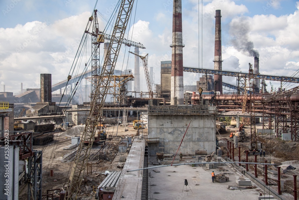 landscape, panorama, view of factory slums with metal hulls and machines for the production of the coking industry, smoking pipes and reconstruction of a plant in Ukraine landscape, panorama, view of factory slums with metal hulls and machines for the production of the coking industry, smoking pipes and reconstruction of a plant in Ukraine
