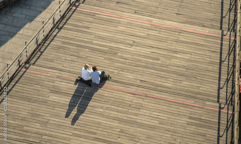 Naklejka premium Enjoying view on city's ladders