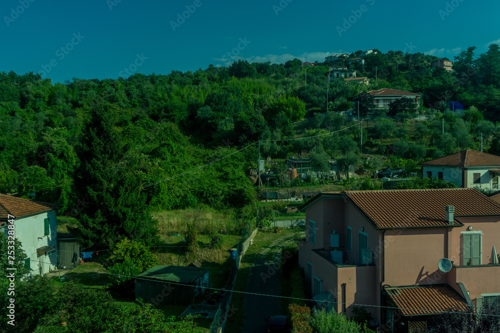 Italy,La Spezia to Kasltelruth train, a house with trees in the background