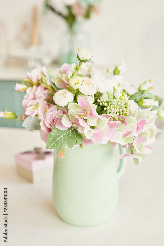 bouquet of flowers in a vase on the table in the kitchen