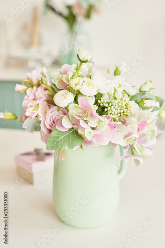 bouquet of flowers in a vase on the table in the kitchen