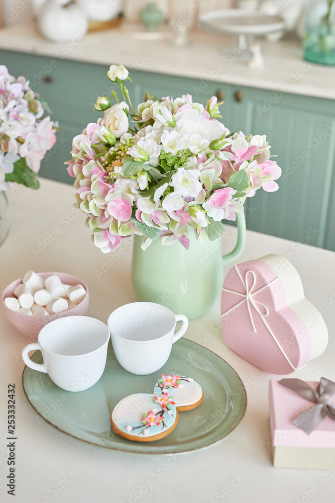Gingerbreads for March 8 in the bright kitchen with flowers Gingerbreads for March 8 in the bright kitchen with flowers