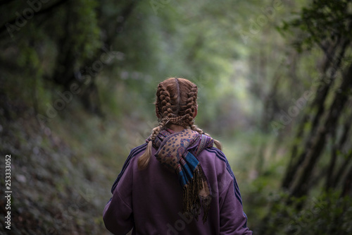 Wallpaper Mural Back of a woman walking through the woods Torontodigital.ca