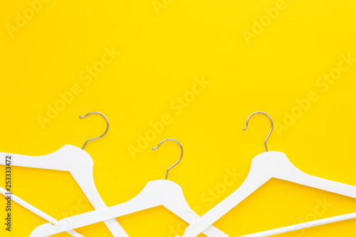 White hangers background for sale shopping concept