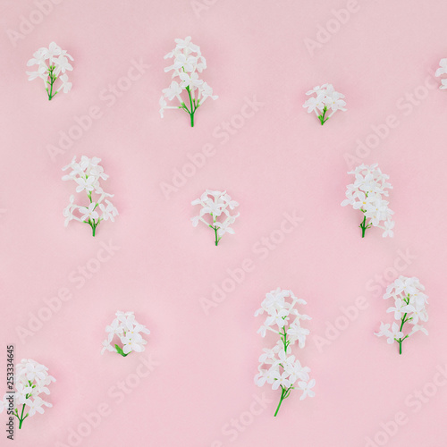 Pink background with white lilac flowers © dvoevnore