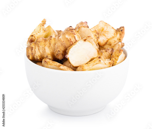 Jerusalem artichoke in bowl on white background