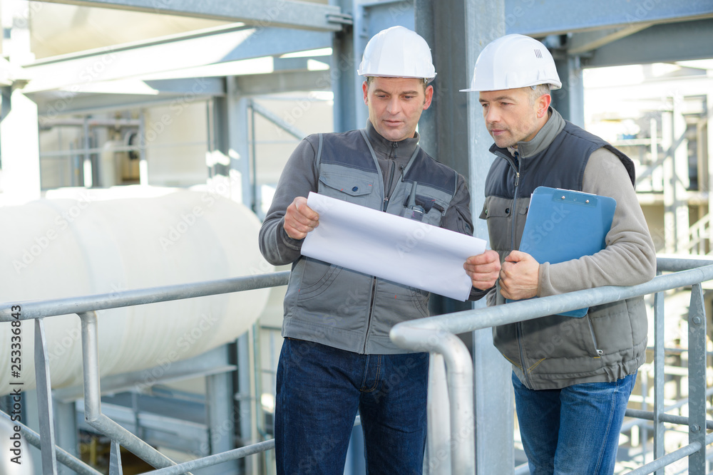 two employees working in factory two employees working in factory