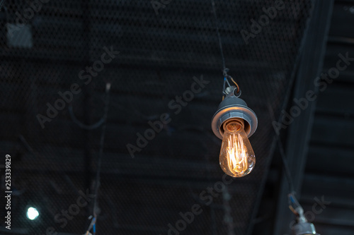 Vintage style light bulb in a cafe shop © warongdech