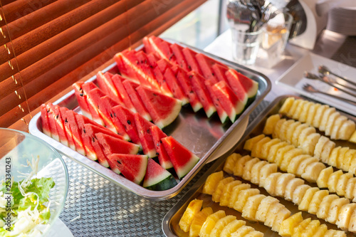 Watermelon and pineapple cut into pieces for breakfast