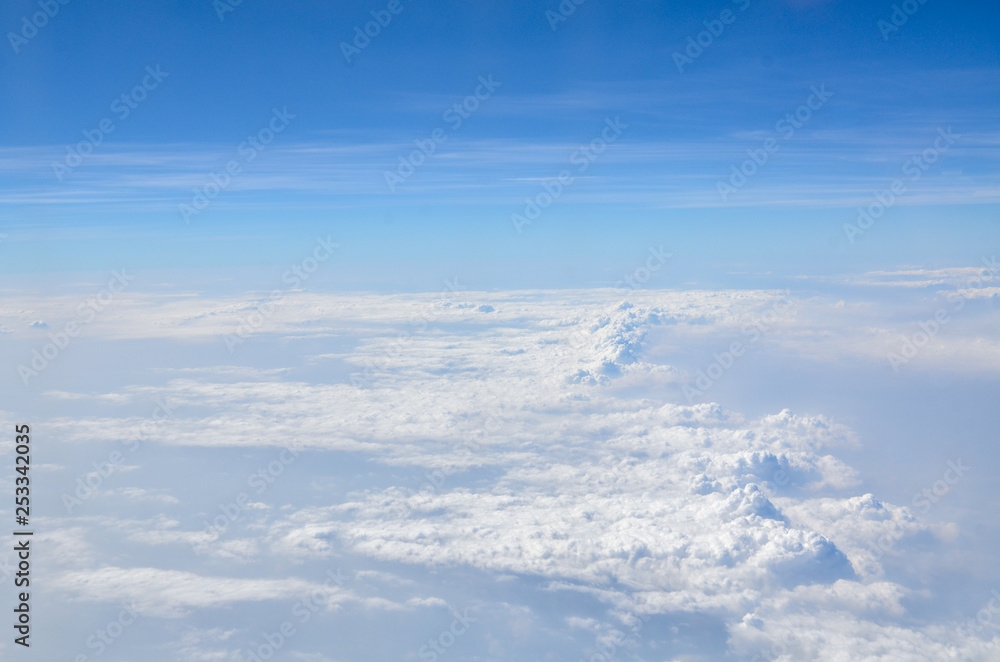 The sky with clouds view from airplane window The sky with clouds view from airplane window