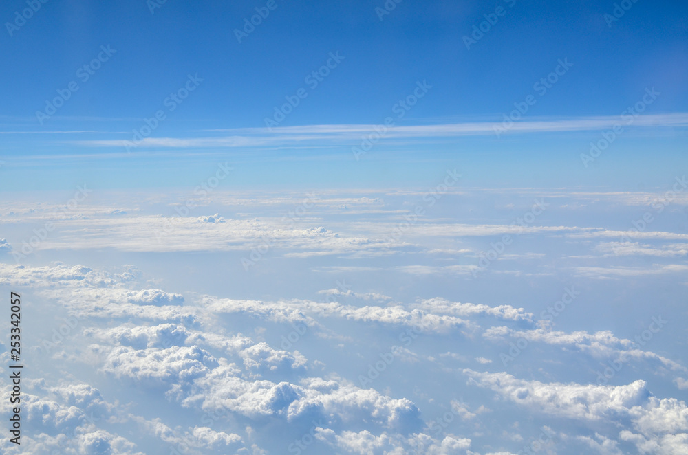 The sky with clouds view from airplane window The sky with clouds view from airplane window