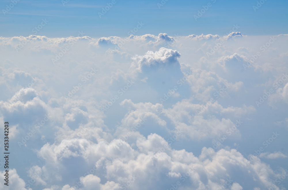 Fototapeta premium The sky with clouds view from airplane window