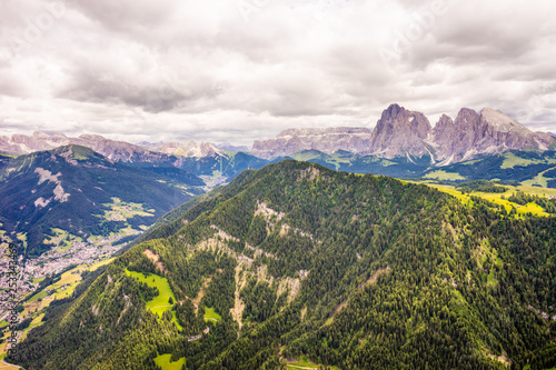 Alpe di Siusi, Seiser Alm with Sassolungo Langkofel Dolomite, a large mountain in the background © SkandaRamana