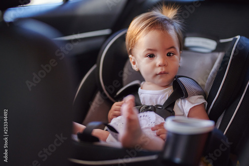 Cute baby girl in car seat
